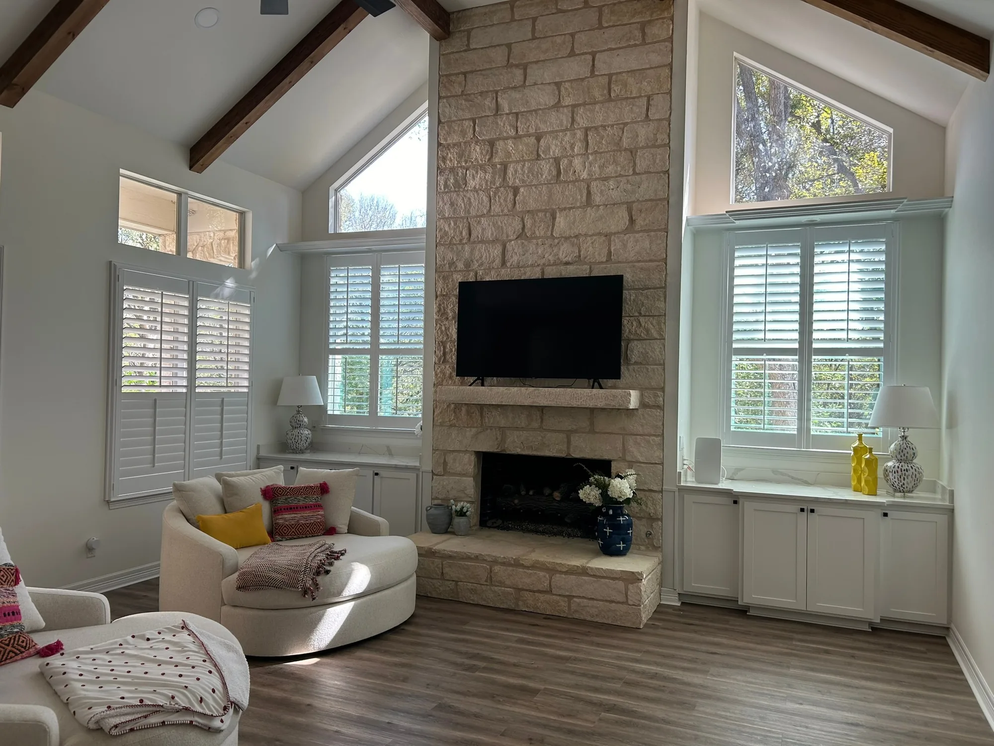 Interior plantation shutters in a bright room, installed by Love Is Blinds
