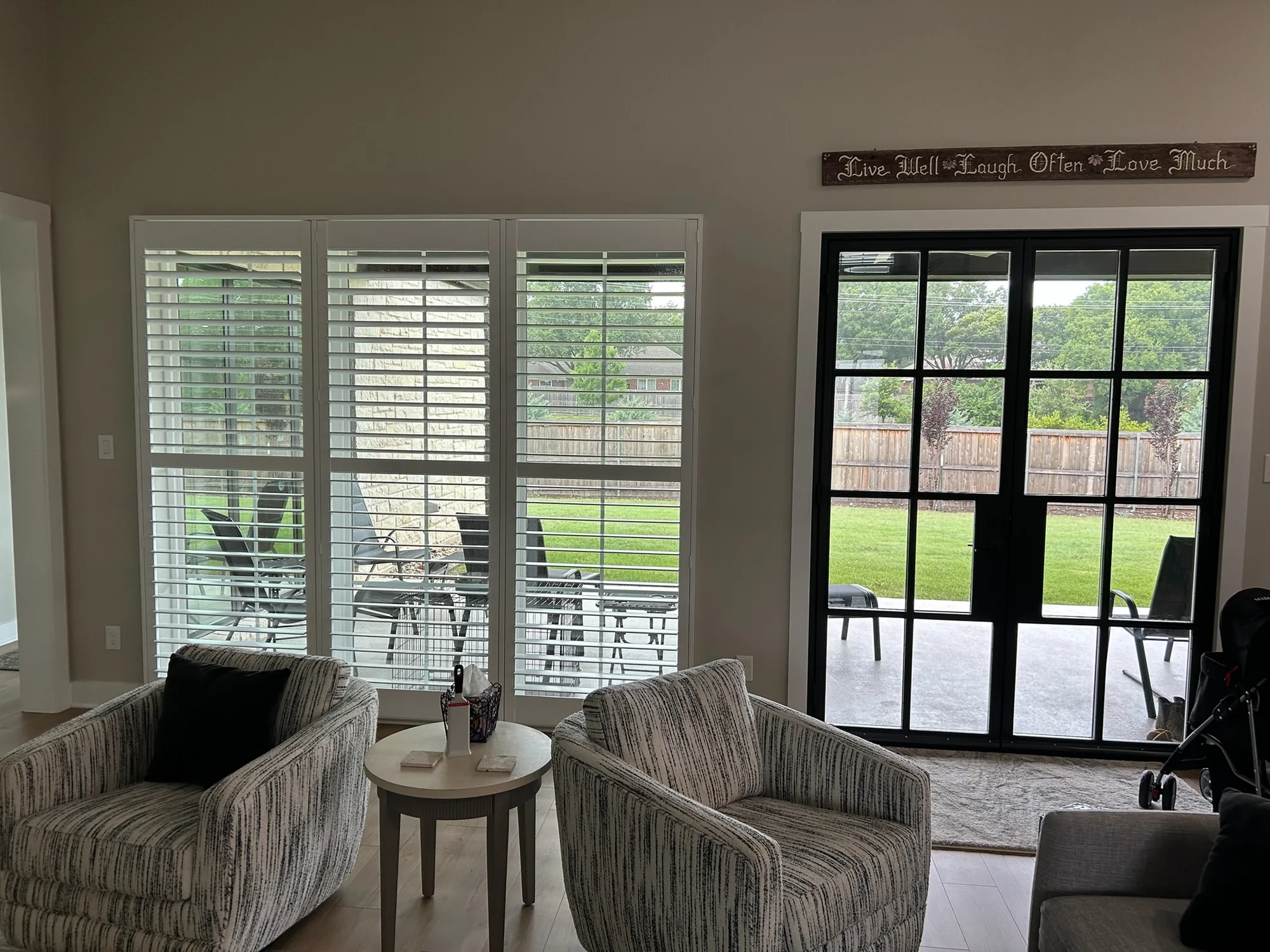 Interior plantation shutters in a bright room, installed by Love Is Blinds